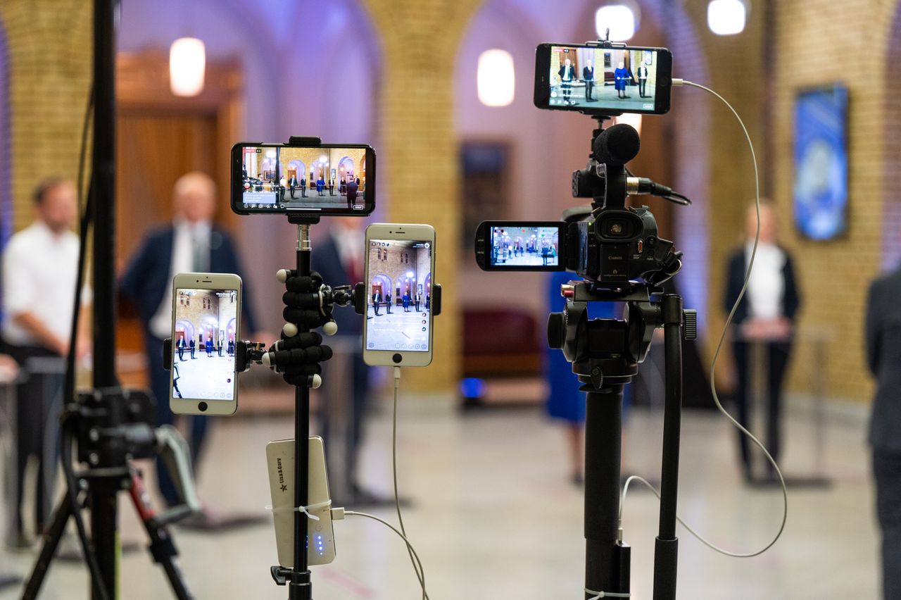 The Art of Drawing Readers In: Your attractive post title goes here Multi-camera setup capturing a live event indoors, showcasing modern filming technology.